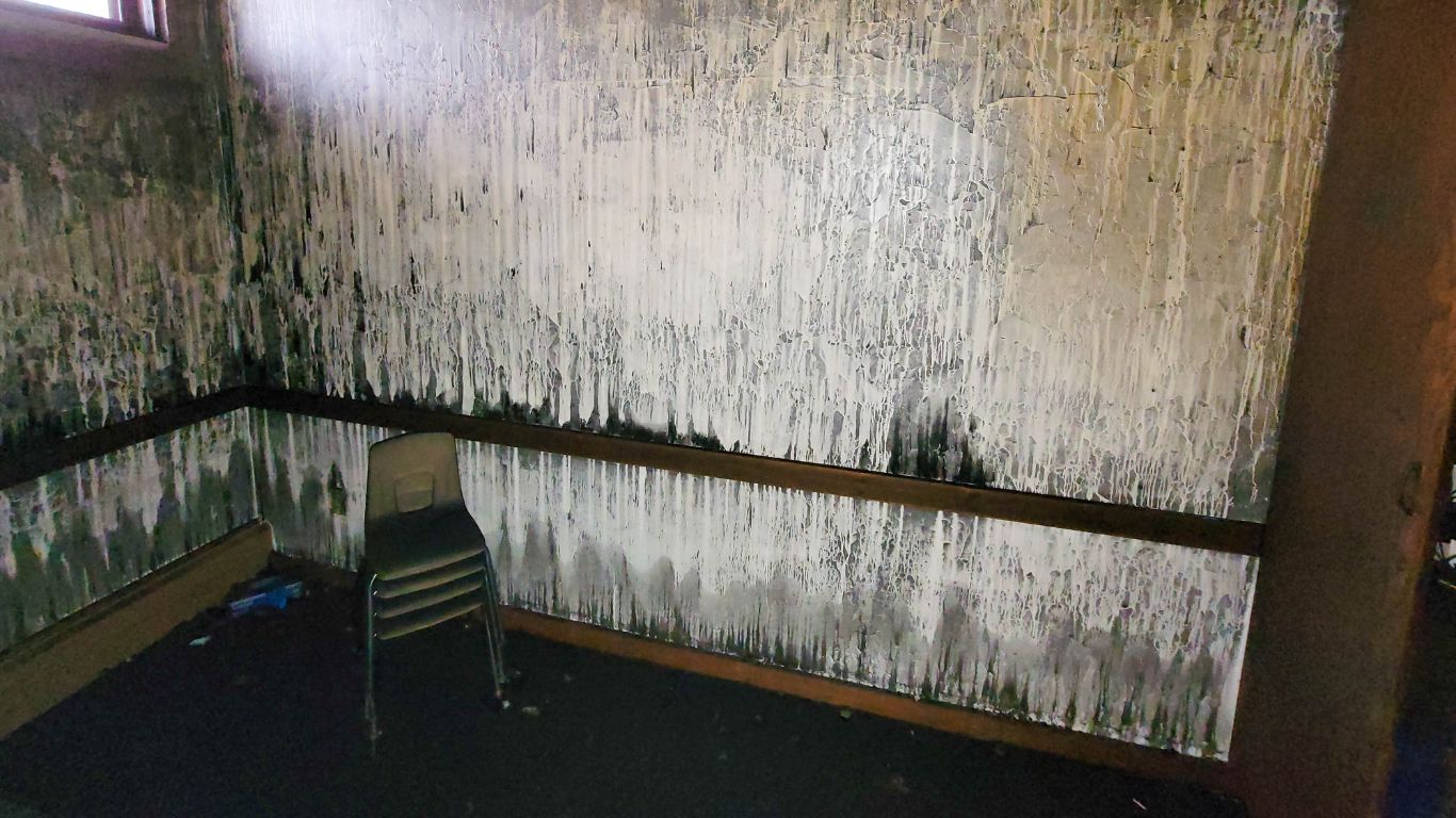 Smoke-stained walls and interior after a house fire undergoing professional fire damage restoration.
