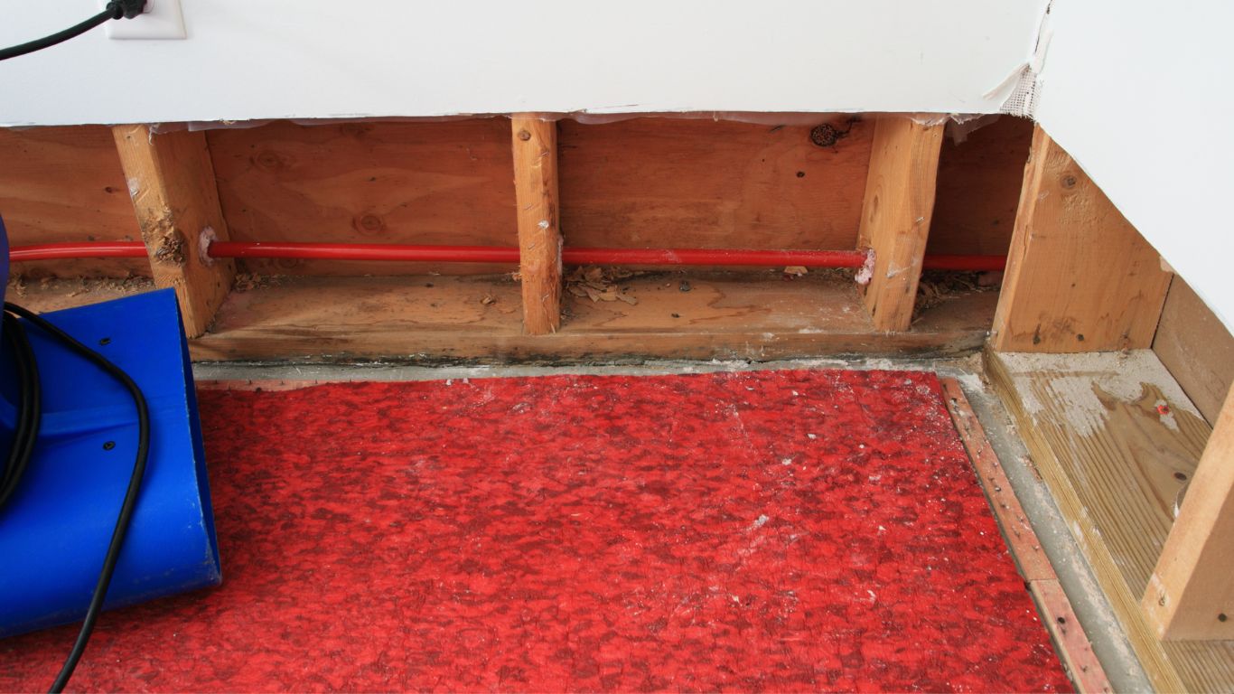 Water damage restoration in Boston: Advanced drying equipment removing moisture from the walls.