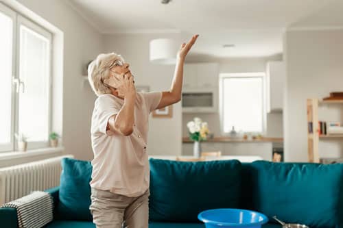 woman on the phone looking at the ceiling 